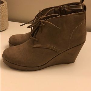 Suede booties, ties in the front. Never been worn!